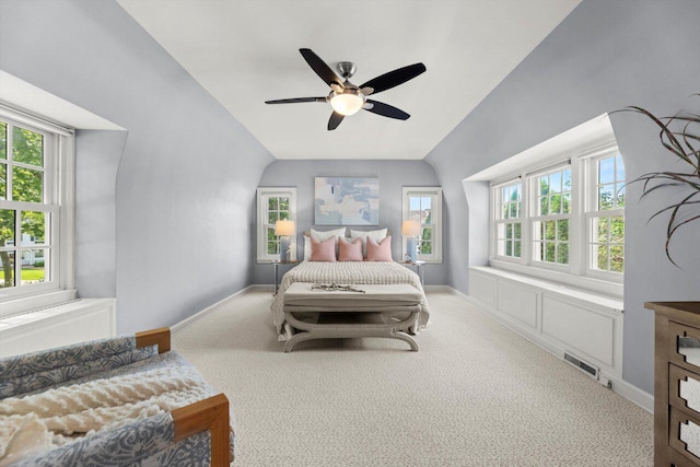 6123 N Berkeley Blvd, Whitefish Bay, WI 53217 - carpeted bedroom with lofted ceiling, multiple windows, and a ceiling fan