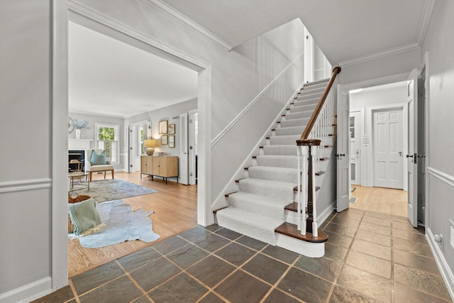 6123 N Berkeley Blvd, Whitefish Bay, WI 53217 - staircase featuring a fireplace and ornamental molding