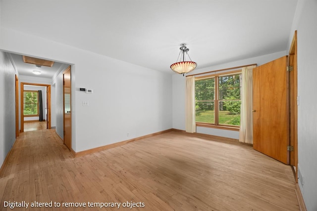 452 Woodland Dr, Wisconsin Rapids, WI 54494 - unfurnished dining area featuring light wood finished floors and baseboards