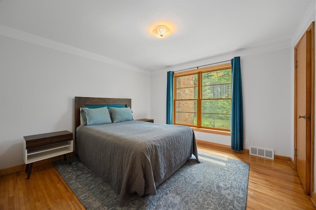 452 Woodland Dr, Wisconsin Rapids, WI 54494 - bedroom featuring light wood-style flooring and baseboards