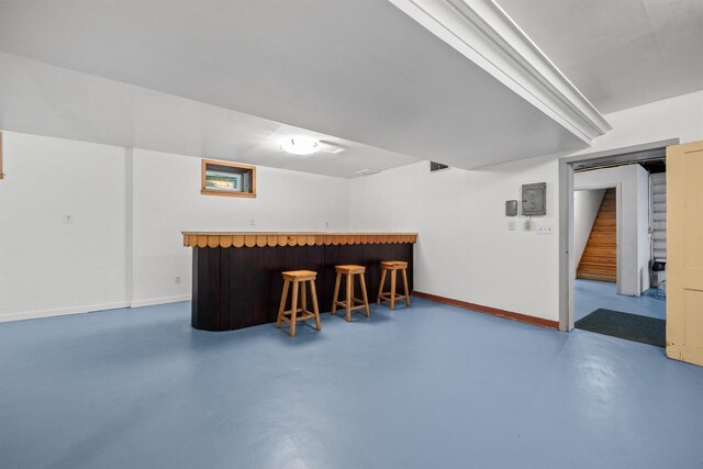 452 Woodland Dr, Wisconsin Rapids, WI 54494 - indoor bar featuring concrete flooring and stairway