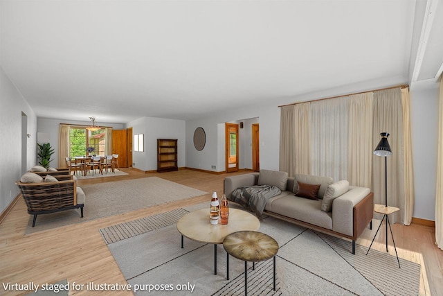 452 Woodland Dr, Wisconsin Rapids, WI 54494 - living area featuring light wood-type flooring and baseboards