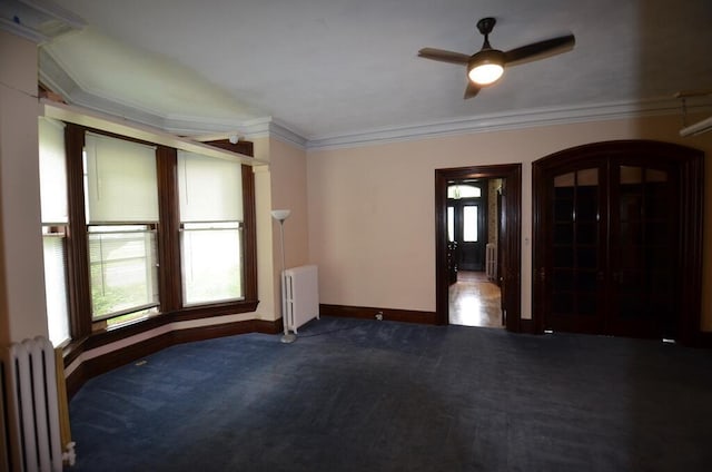 727 W Center St, Whitewater, WI 53190 - empty room with radiator, carpet, ceiling fan, and ornamental molding
