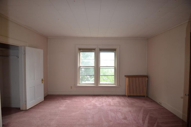 727 W Center St, Whitewater, WI 53190 - unfurnished bedroom featuring radiator, light colored carpet, and crown molding