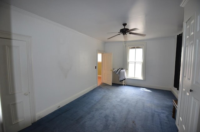 727 W Center St, Whitewater, WI 53190 - empty room featuring a ceiling fan, dark carpet, and ornamental molding