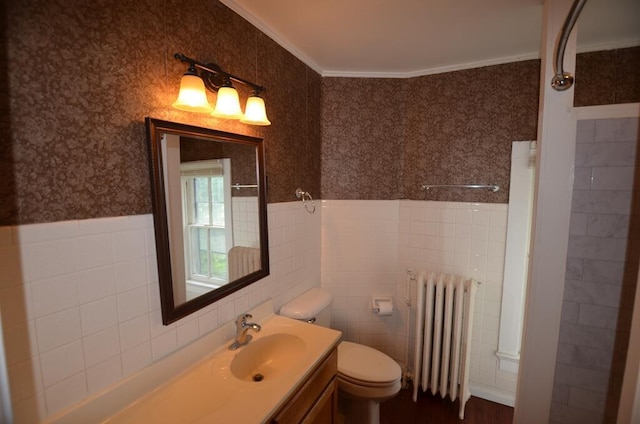 727 W Center St, Whitewater, WI 53190 - bathroom with radiator, ornamental molding, tile walls, vanity, and wallpapered walls