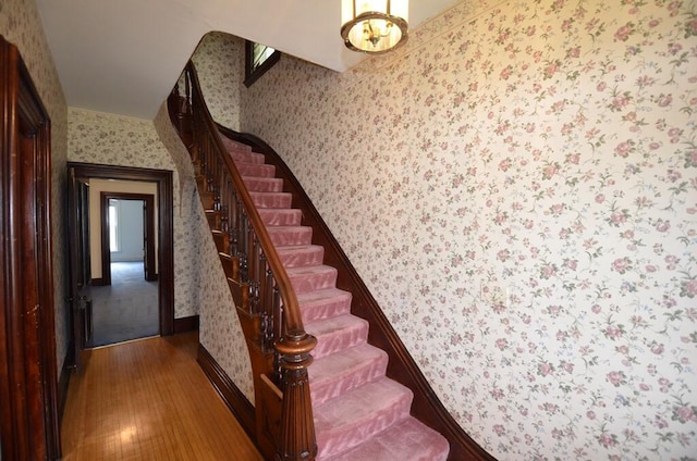 727 W Center St, Whitewater, WI 53190 - stairs with wallpapered walls and wood finished floors