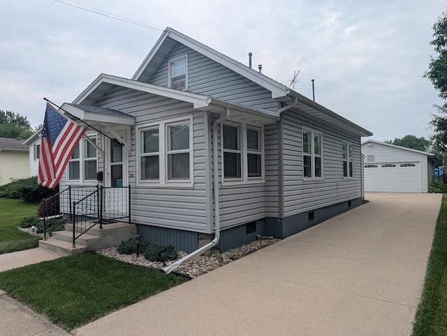 219 Guenther St, Oshkosh, WI 54902 - view of front of home with an outbuilding and a detached garage