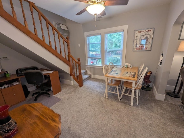 219 Guenther St, Oshkosh, WI 54902 - dining space featuring stairs, light colored carpet, ceiling fan, and a desk