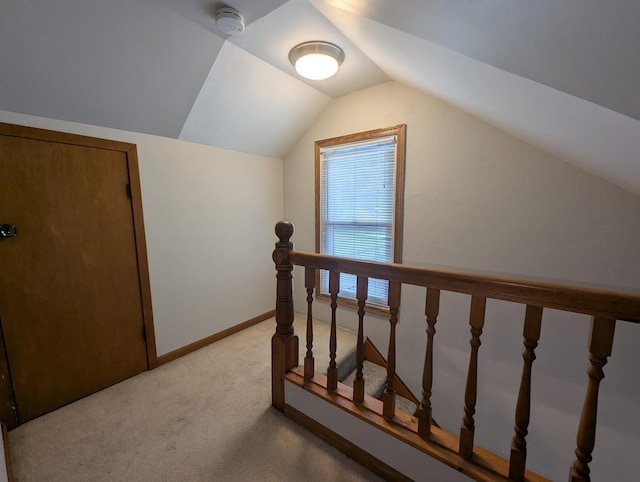 219 Guenther St, Oshkosh, WI 54902 - staircase with carpet floors and vaulted ceiling