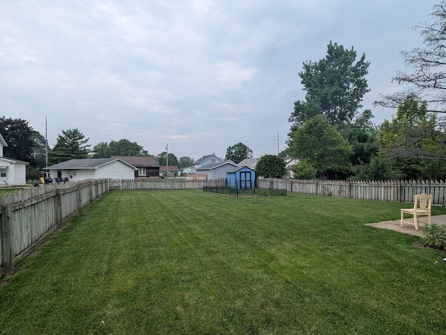 219 Guenther St, Oshkosh, WI 54902 - fenced backyard featuring a shed