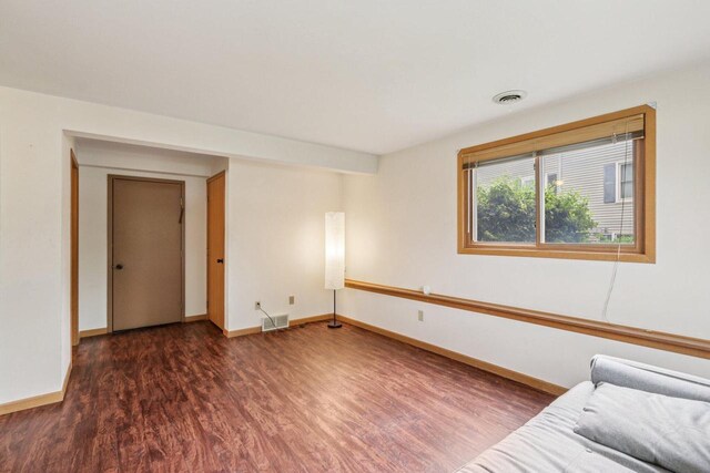 10268 W Parkedge Cir, Franklin, WI 53132 - unfurnished living room featuring wood finished floors and baseboards