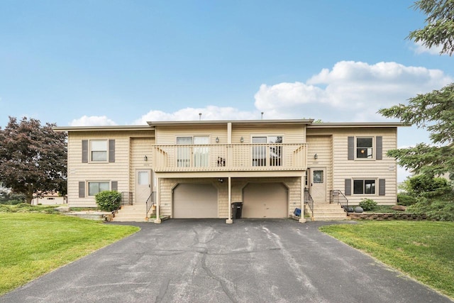 10268 W Parkedge Cir, Franklin, WI 53132 - multi unit property with a balcony, a front yard, asphalt driveway, and a garage