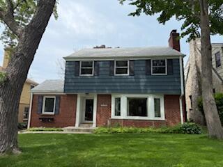 6265 N Bay Ridge Ave, Whitefish Bay, WI 53217 - colonial house featuring brick siding, a front lawn, and a chimney