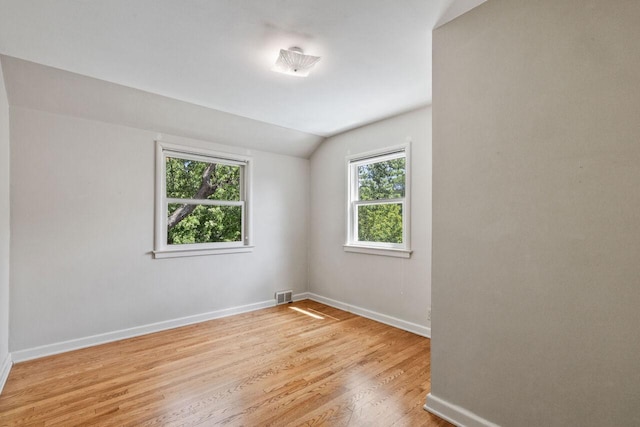 6265 N Bay Ridge Ave, Whitefish Bay, WI 53217 - unfurnished room featuring lofted ceiling and light wood-style flooring