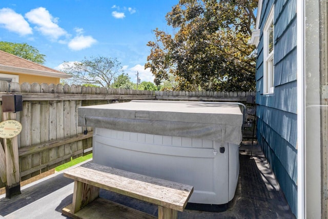 6265 N Bay Ridge Ave, Whitefish Bay, WI 53217 - exterior view of a fenced backyard and a hot tub
