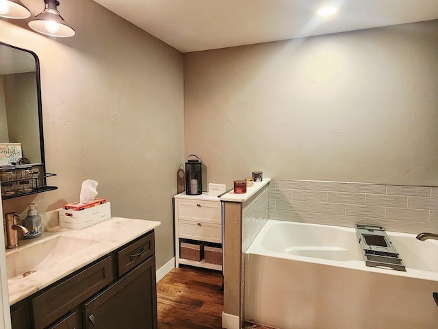 104 Mark Ct, Eden, WI 53019 - full bathroom with vanity, wood finished floors, and a bath