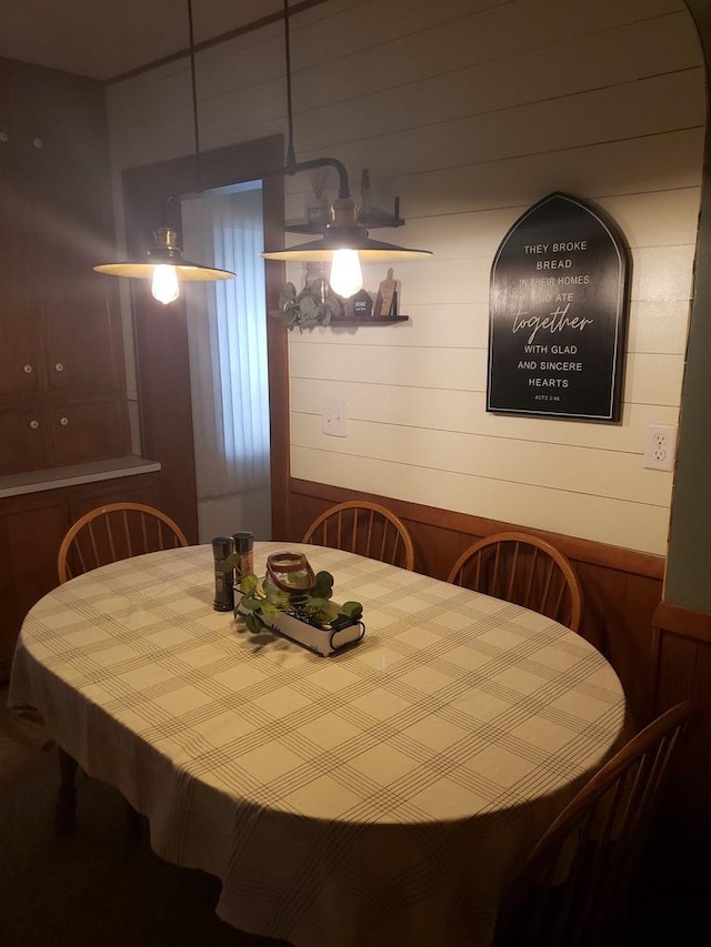809 N 5th Ave, Wausau, WI 54401 - dining space featuring wood walls