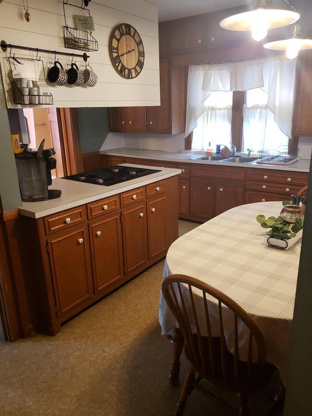 809 N 5th Ave, Wausau, WI 54401 - kitchen with black electric stovetop, light countertops, and brown cabinetry