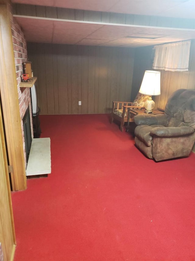 809 N 5th Ave, Wausau, WI 54401 - living area featuring carpet flooring, wooden walls, and a fireplace