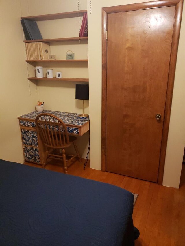 809 N 5th Ave, Wausau, WI 54401 - bedroom featuring wood finished floors and a desk