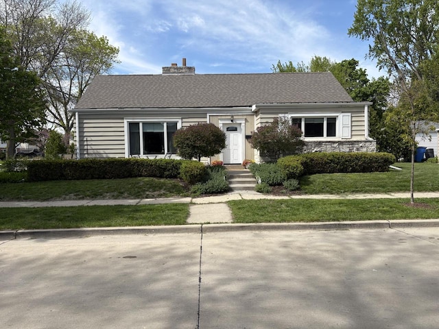 150 E Fairmount Ave, Whitefish Bay, WI 53217 - view of front of property featuring a chimney and a front yard