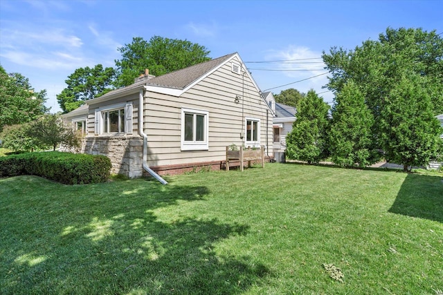 150 E Fairmount Ave, Whitefish Bay, WI 53217 - back of house with a yard, a chimney, and a shingled roof