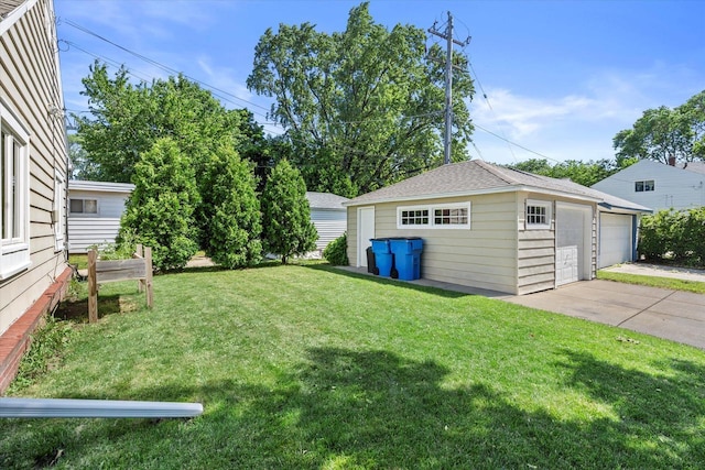 150 E Fairmount Ave, Whitefish Bay, WI 53217 - view of green lawn featuring an outdoor structure and a detached garage