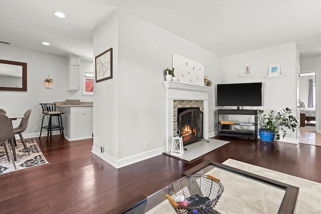 150 E Fairmount Ave, Whitefish Bay, WI 53217 - living room featuring hardwood / wood-style flooring, a stone fireplace, and recessed lighting