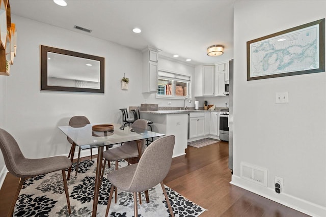 150 E Fairmount Ave, Whitefish Bay, WI 53217 - dining space featuring dark wood finished floors and recessed lighting