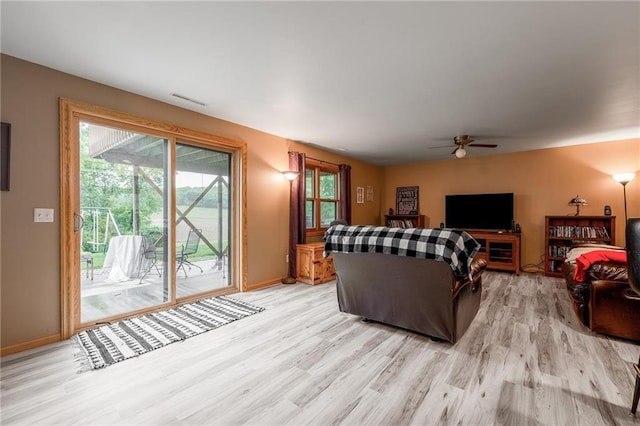 10525 Voight Rd, Fall Creek, WI 54742 - living room featuring light wood-style floors, healthy amount of natural light, and a ceiling fan