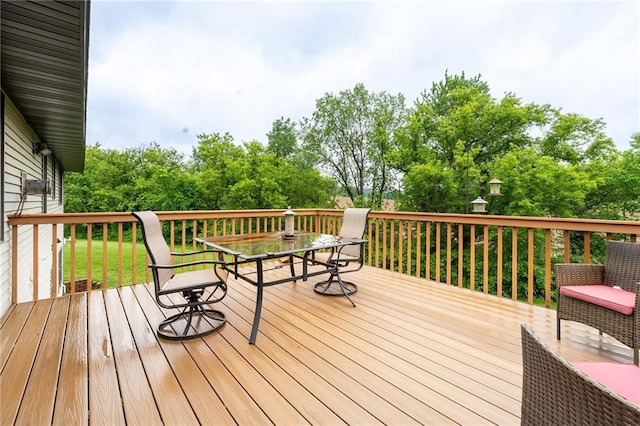 10525 Voight Rd, Fall Creek, WI 54742 - wooden deck with outdoor dining area and view of scattered trees