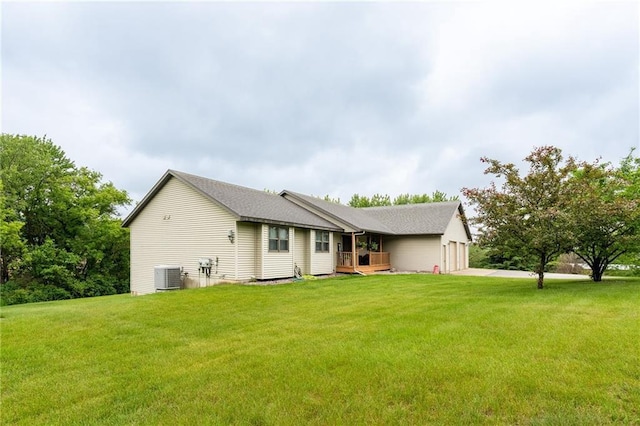10525 Voight Rd, Fall Creek, WI 54742 - rear view of property with a lawn and a garage