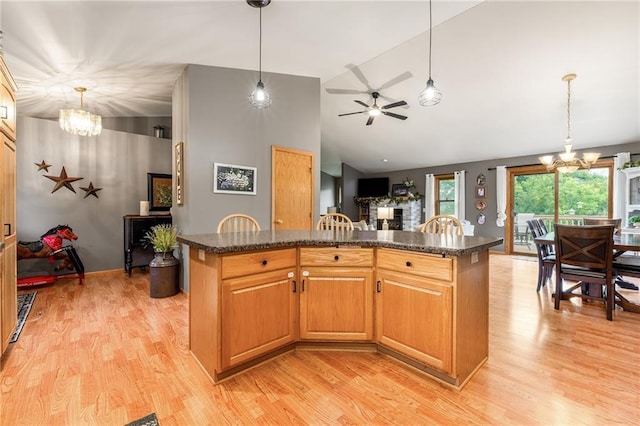 10525 Voight Rd, Fall Creek, WI 54742 - kitchen with a chandelier, light wood finished floors, vaulted ceiling, and a kitchen island