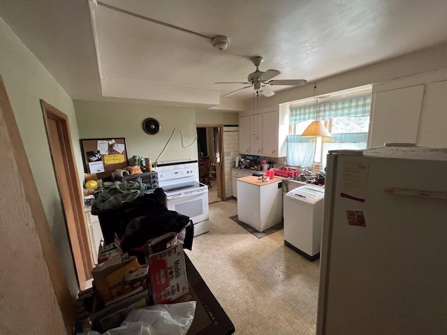 3671 E Plankinton Ave Unit 3673, Cudahy, WI 53110 - kitchen featuring white appliances, white cabinetry, ceiling fan, backsplash, and light countertops