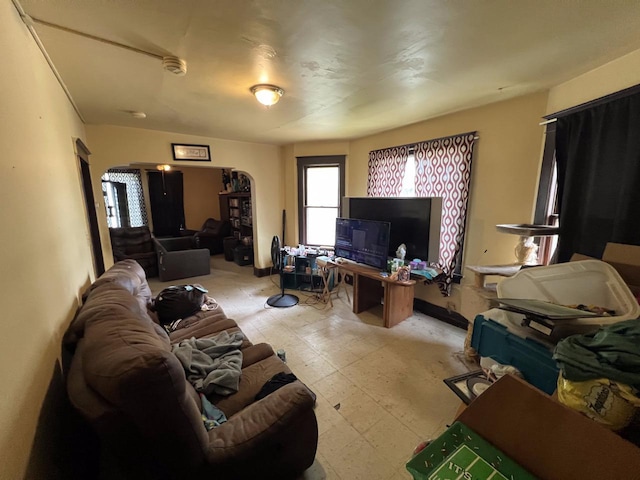 3671 E Plankinton Ave Unit 3673, Cudahy, WI 53110 - living room featuring light flooring and arched walkways