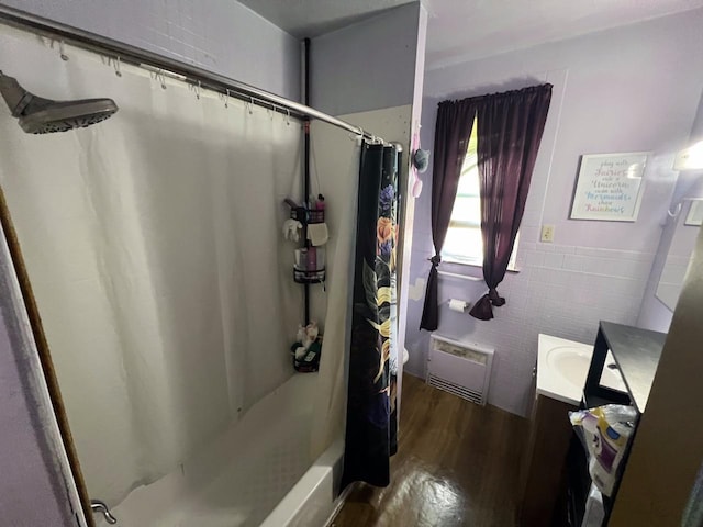 3671 E Plankinton Ave Unit 3673, Cudahy, WI 53110 - full bath with vanity, wood finished floors, tile walls, and shower / bath combination with curtain