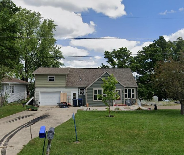 N7082 Airport Rd, Beaver Dam, WI 53916 - view of front of home featuring driveway, a garage, and a front yard