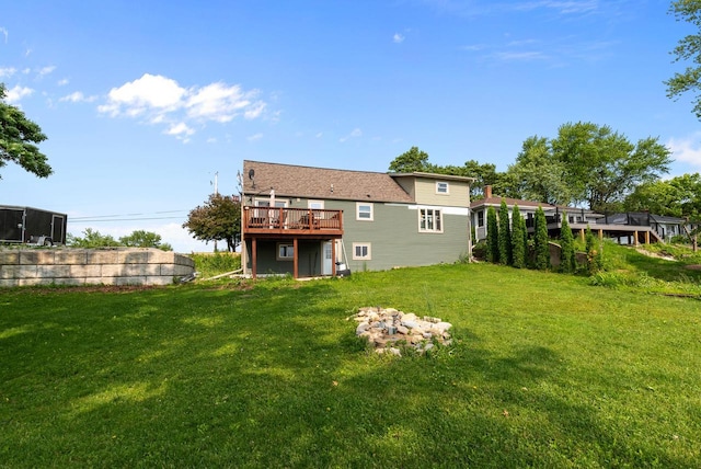 N7082 Airport Rd, Beaver Dam, WI 53916 - rear view of house with a wooden deck and a yard