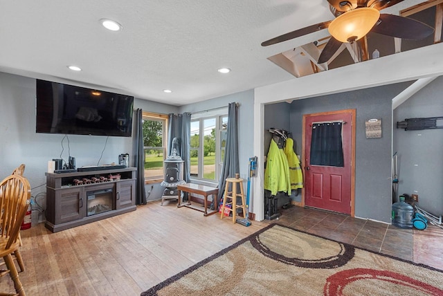 N7082 Airport Rd, Beaver Dam, WI 53916 - living room featuring a ceiling fan, recessed lighting, and a textured ceiling