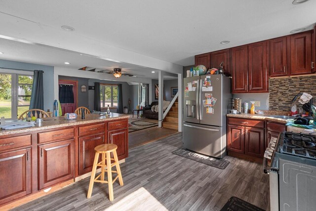 N7082 Airport Rd, Beaver Dam, WI 53916 - kitchen with appliances with stainless steel finishes, dark wood finished floors, plenty of natural light, a ceiling fan, and recessed lighting