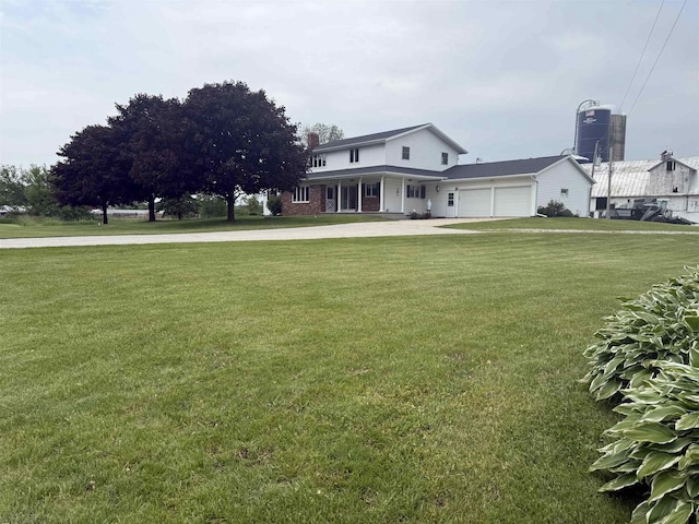 8478 N Brown County Line Rd, Pulaski, WI 54162 - view of green lawn featuring a garage and driveway