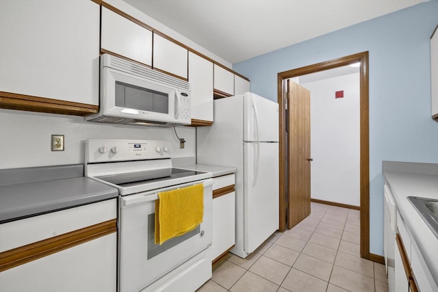 4008 81st St Unit B, Kenosha, WI 53142 - kitchen with white appliances, white cabinets, light tile patterned floors, and light countertops