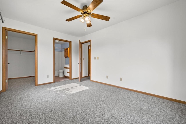 4008 81st St Unit B, Kenosha, WI 53142 - unfurnished bedroom featuring carpet, a spacious closet, a closet, ensuite bath, and a ceiling fan
