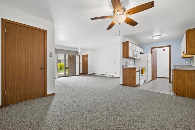 4008 81st St Unit B, Kenosha, WI 53142 - kitchen featuring white appliances, a baseboard radiator, light colored carpet, a ceiling fan, and brown cabinetry