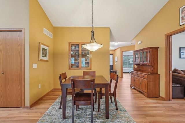 1910 Cedar St, Grafton, WI 53024 - dining room featuring light wood-style flooring and high vaulted ceiling