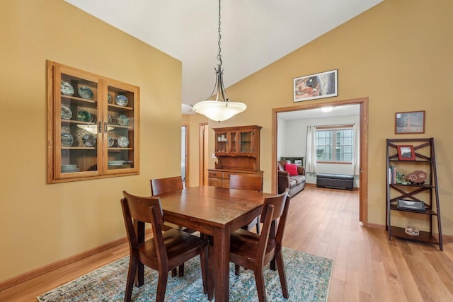 1910 Cedar St, Grafton, WI 53024 - dining area with light wood-type flooring and high vaulted ceiling