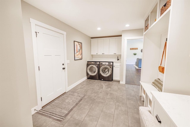 3717 White Pine Dr, Janesville, WI 53545 - washroom featuring cabinet space, washing machine and dryer, recessed lighting, and light wood-type flooring