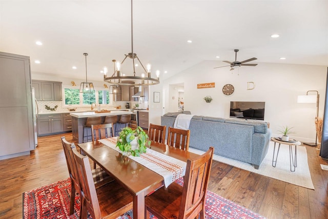 3717 White Pine Dr, Janesville, WI 53545 - dining space with a ceiling fan, light wood-type flooring, recessed lighting, a chandelier, and vaulted ceiling