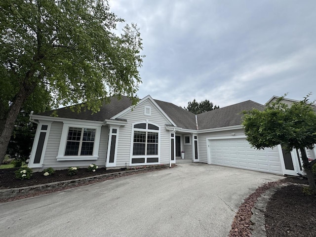 N53W16527 Whitetail Run, Menomonee Falls, WI 53051 - single story home with driveway, an attached garage, and roof with shingles